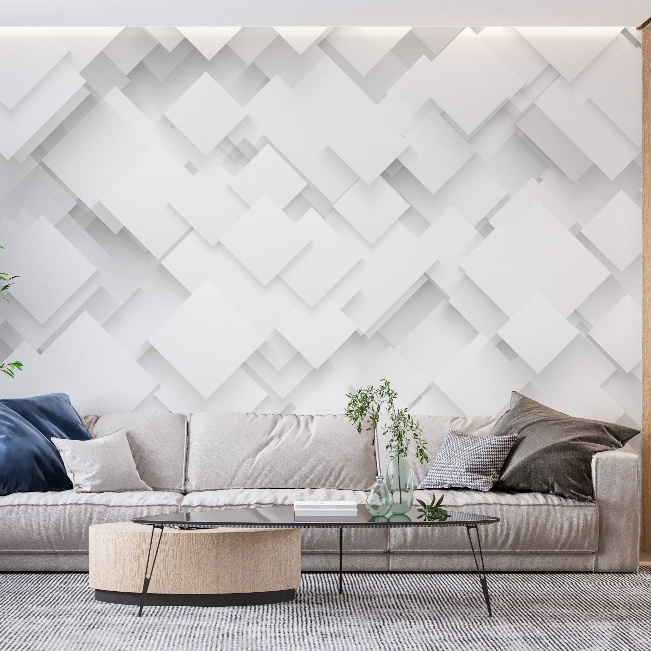 Contemporary office space featuring white 3D geometric wall mural behind sleek desk setup