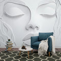 3D relief wallpaper creating dramatic shadows in modern minimalist living room, soft natural lighting highlights sculptural details