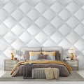 Modern white 3D diamond wallpaper in a bright living room with minimal furniture and large windows