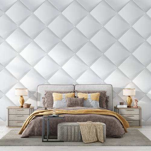 Modern white 3D diamond wallpaper in a bright living room with minimal furniture and large windows