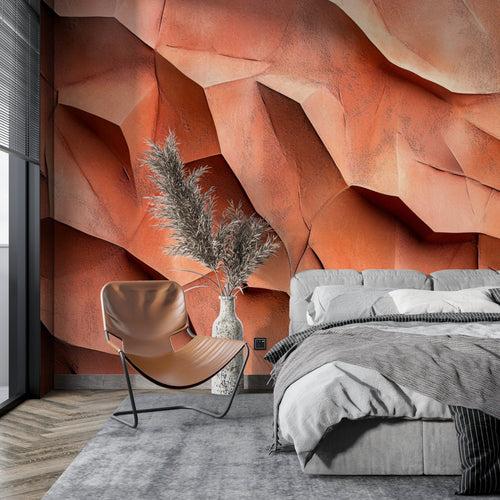 Modern living room featuring 3D terracotta geometric wallpaper creating dramatic shadows and depth