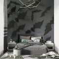 Black 3D leaf wallpaper in modern living room with grey sofa and pendant lights