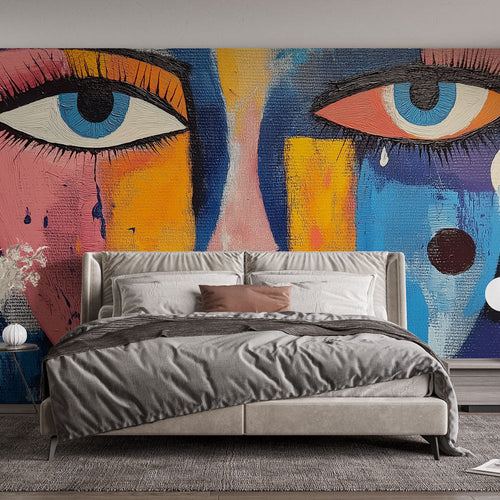Abstract face mural wallpaper bringing urban art style to a modern living room with dramatic lighting and minimalist furniture