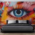 Modern abstract eye wallpaper creating a bold statement in a minimalist living room with white furniture