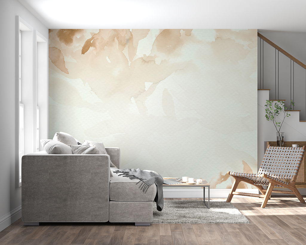 Beige watercolor leaf wallpaper in a bright living room creating a calm atmosphere