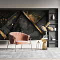 Black and gold geometric wallpaper in modern living room creating dramatic accent wall with metallic highlights