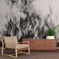 Black and white abstract grass wallpaper creating dramatic impact in a modern minimalist living room with natural lighting