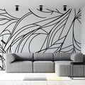 Abstract line art wallpaper creating dramatic impact in a modern living room with minimalist furniture