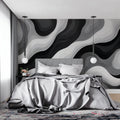 Black and white wave mural wallpaper in a modern living room creating dramatic visual impact