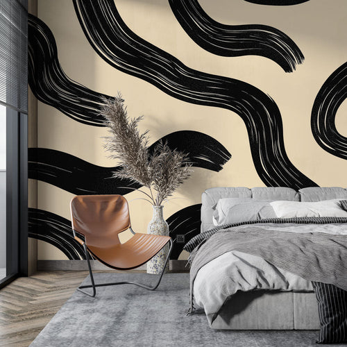 Modern abstract wave wallpaper creating dramatic impact in a minimalist living room with black and cream contrasts