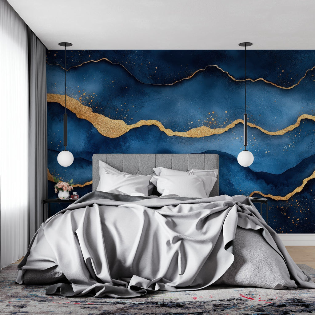 Blue and gold abstract wallpaper creating depth in modern living room with grey sofa
