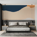 Modern living room with blue and terracotta abstract wave wallpaper creating a peaceful atmosphere