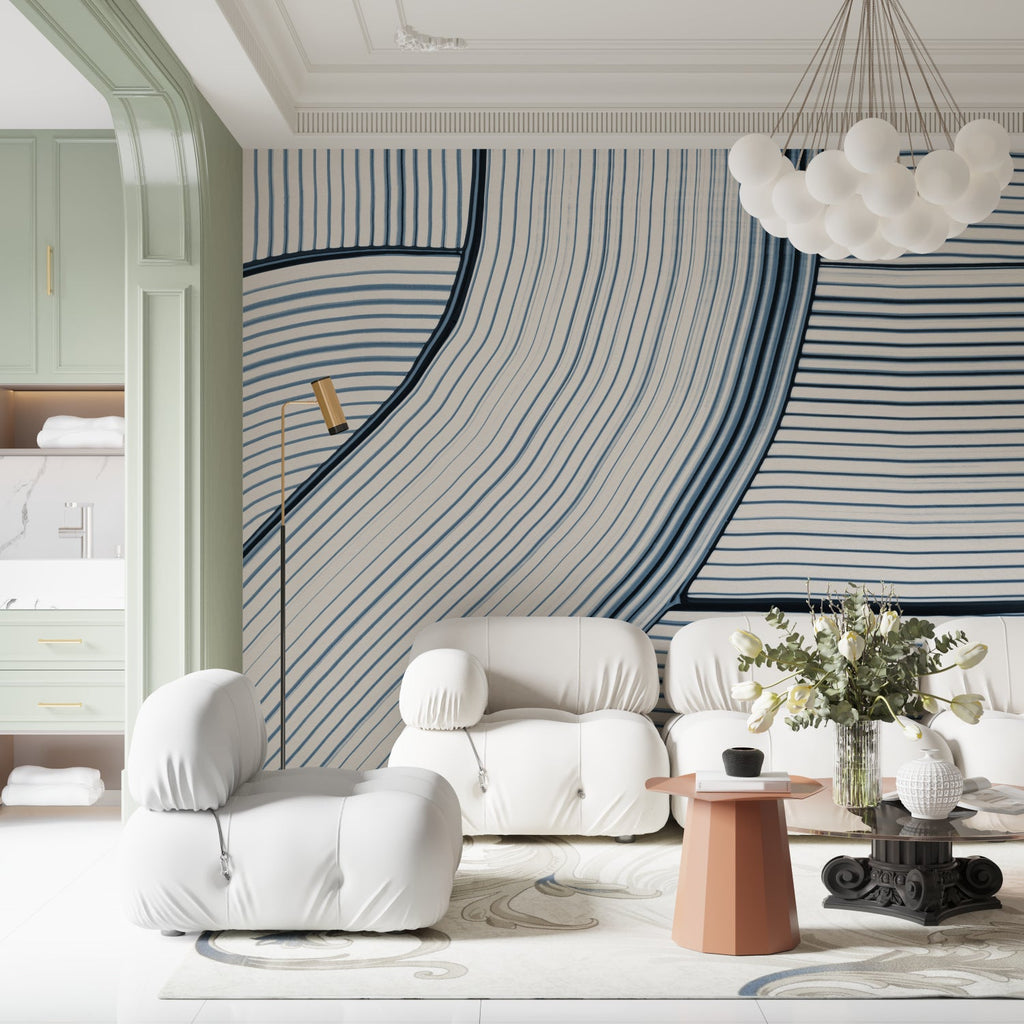 Blue wave line pattern wallpaper in a modern living room with white furniture and natural light