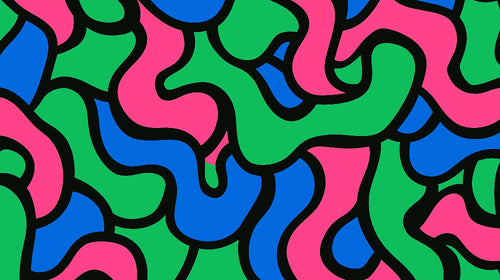 Modern abstract wallpaper with pink, green and blue geometric pattern styled in a bright contemporary living room setting