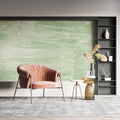 Green abstract wallpaper mural in modern living room with minimalist furniture and natural light