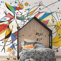 Abstract geometric wallpaper creating a bold statement in a modern living room with white furniture and natural light