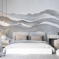 Modern abstract mountain wallpaper with dotted wave pattern shown in a minimalist living room with natural light