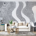 Modern living room featuring Abstract Dot Wave Wallpaper in black and white, creating a stunning accent wall behind a minimalist sofa