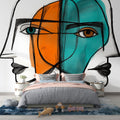 Modern abstract geometric face mural displayed in a minimalist living room, creating a bold artistic focal point