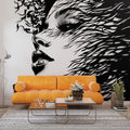 Black and white abstract portrait mural wallpaper creating dramatic impact in modern living room setting