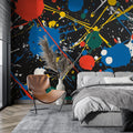 Abstract paint splash wallpaper mural in a modern minimalist living room with white furniture and natural lighting
