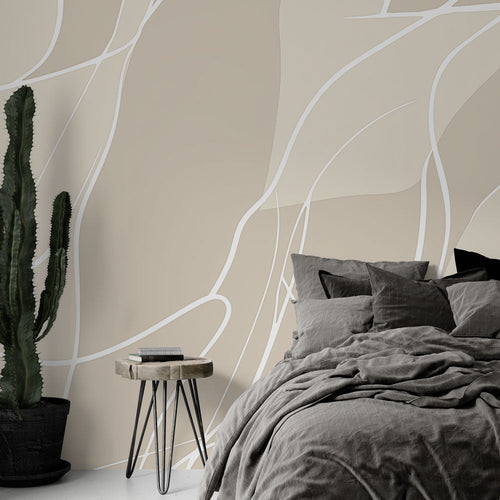 Abstract line wallpaper creating a serene atmosphere in a modern minimalist living room with beige and white flowing patterns