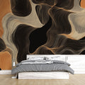 Modern abstract black and gold wallpaper mural creating dramatic impact in a minimalist living room setting