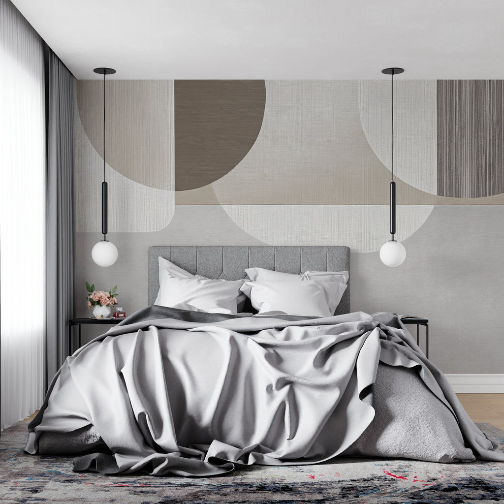 Abstract geometric wall mural in a minimal bedroom highlighting soft curves and neutral colors