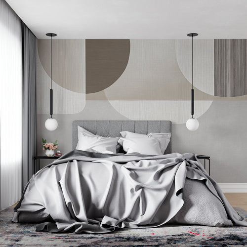 Abstract geometric wall mural in a minimal bedroom highlighting soft curves and neutral colors