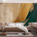 Abstract gold and emerald brushstroke wallpaper creating a stunning focal point in a modern living room with natural light