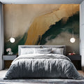 Abstract fluid art wallpaper in green and gold tones creating a dramatic statement wall in a modern living room setting