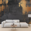 Modern abstract wallpaper with gold splashes creating drama in a minimalist living room setting