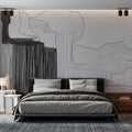Modern abstract wave wallpaper creating dramatic effect in a minimalist living room with natural lighting
