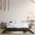 Abstract minimalist wallpaper in modern living room with beige sofa and terracotta accents