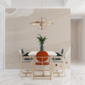Modern wave wallpaper in minimalist living room showing beige linear pattern catching natural light