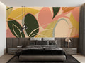 Modern abstract leaf wallpaper creating a fresh focal point in a bright living room with contemporary furniture