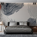 Modern abstract wave wallpaper creating a stunning focal point in a minimalist living room with natural lighting