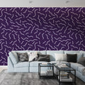 Modern purple wave pattern wallpaper showcased in a minimalist living room with contemporary furniture