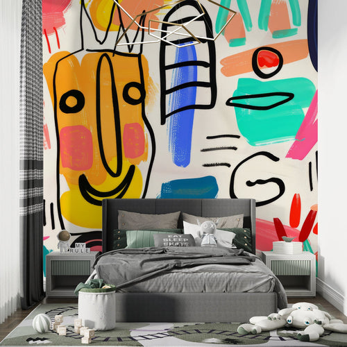 Modern street art wallpaper in bright living room setting with gray sofa and minimalist decor