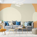 Abstract circle wallpaper creating a warm, modern atmosphere in a minimalist living room with beige and orange tones