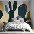 Modern abstract wallpaper with organic shapes in navy and pastels creating a calm atmosphere in a minimalist living room