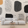 Modern Abstract Geometric Wallpaper showcased in a bright living room with minimalist furniture