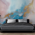Pink and gold marble abstract wallpaper creating a soft, luxurious atmosphere in a modern living room with natural light