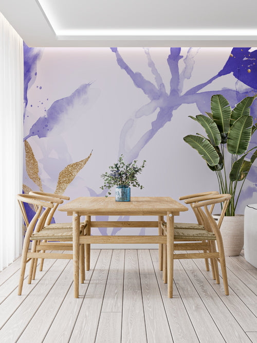 Abstract purple watercolor mural with gold accents in a cozy bedroom setting
