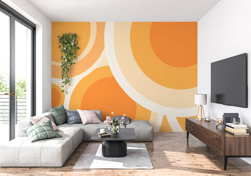 Retro orange circular wallpaper in dining room with mid-century furniture