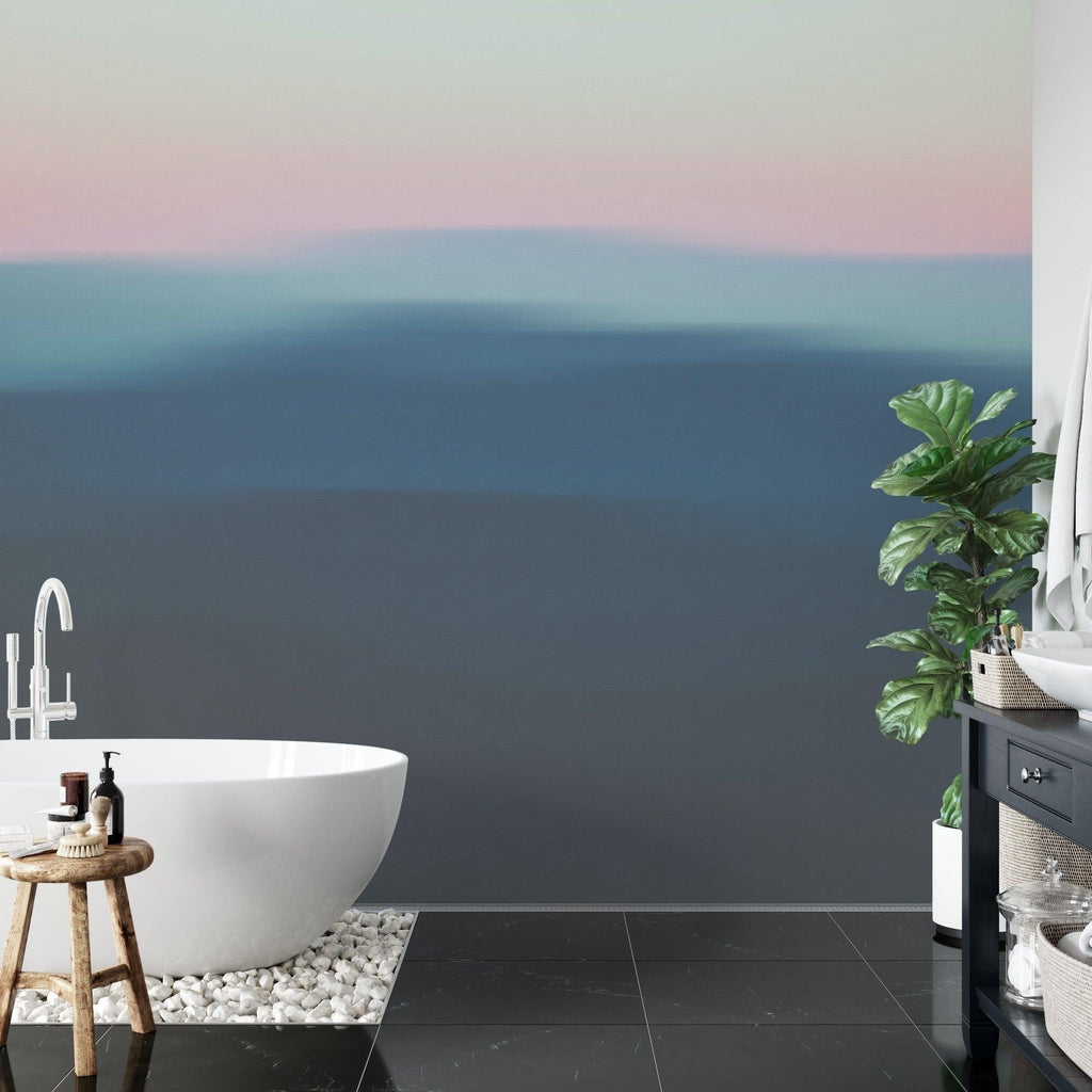 Home office space with abstract sunset gradient wallpaper adding depth and warmth