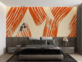 Abstract terracotta wallpaper mural styled in modern living room with grey sofa and minimal decor
