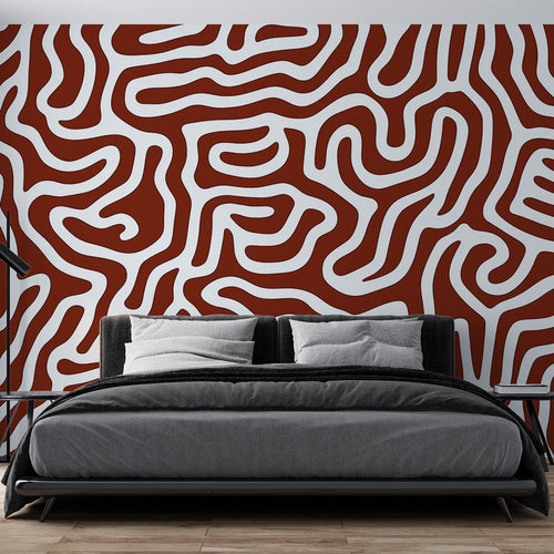 Modern geometric abstract wallpaper in terracotta tones creating a stunning focal point in a minimalist living room