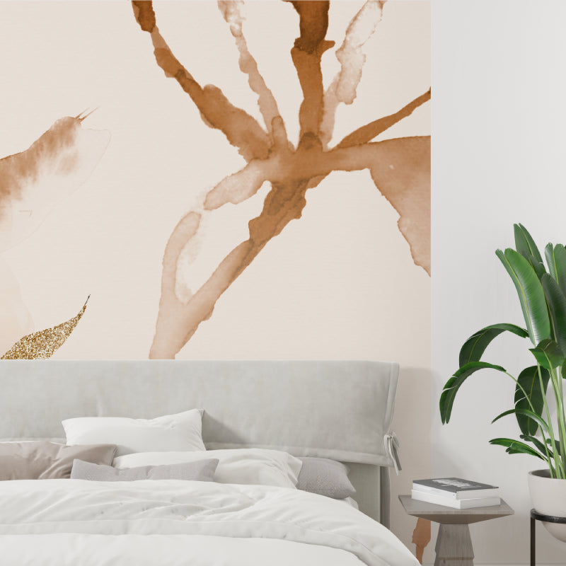 Gold and terracotta abstract wallpaper in master bedroom creating cozy atmosphere