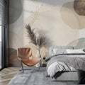 Abstract watercolor wallpaper in earth tones creating a peaceful living room atmosphere with modern furniture